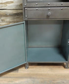 Metal cabinet with open door on a wooden floor