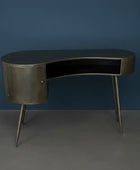 Modern metallic desk against a blue wall