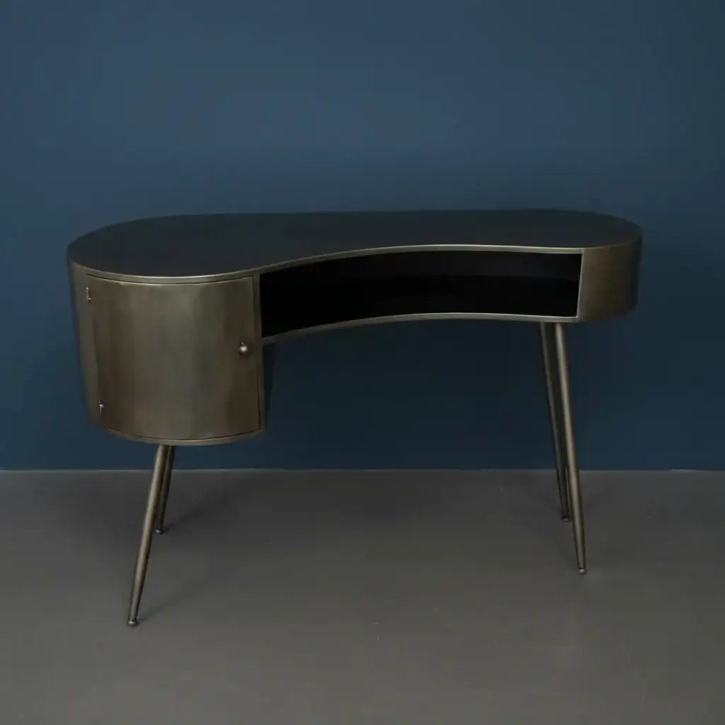Modern metallic desk against a blue wall