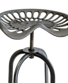 Black metal stool with unique seat design on a white background
