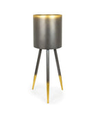 Modern tripod lamp with metallic base and gold accents on a white background
