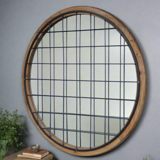 Round window with black grid on a brick wall