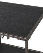 Black metal table with a textured surface on a white background