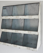 Metallic panel with a grid pattern on a white background