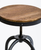 Wooden round table with metal base on a white background