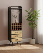 Tall black and wood cabinet with glass shelves in a room with a plant and window.