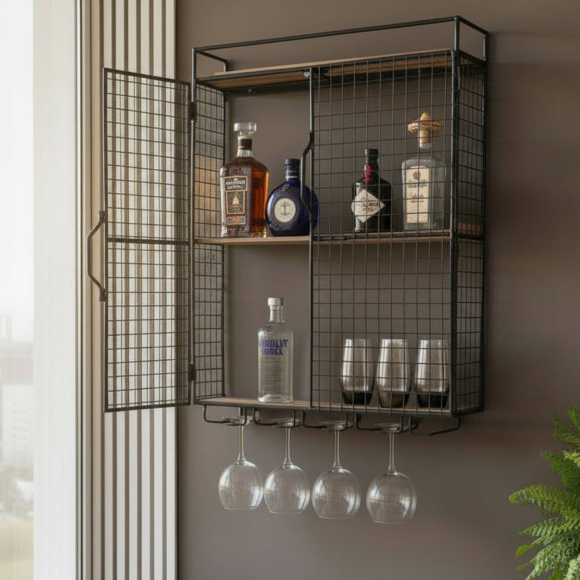 Wall-mounted metal cabinet with liquor bottles and glasses on a neutral background