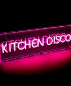 Neon sign with 'KITCHEN DISCO' text on a black background