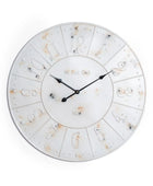 Round wall clock with decorative design on a white background