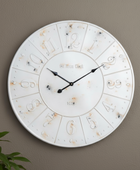 Decorative wall clock with unique design on a plain wall