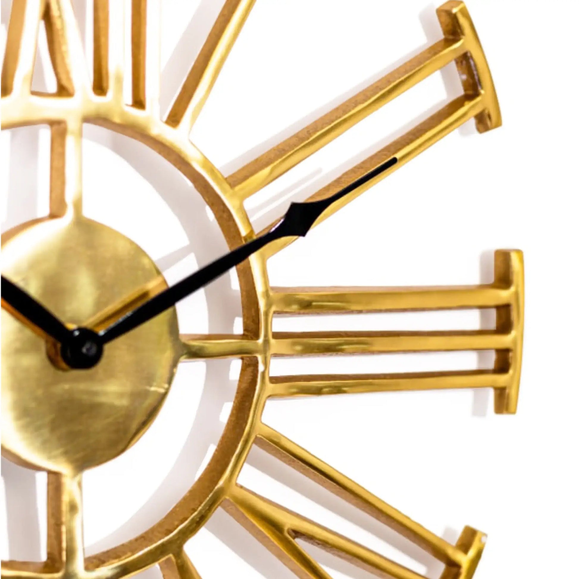 Gold clock with black hands on a white background
