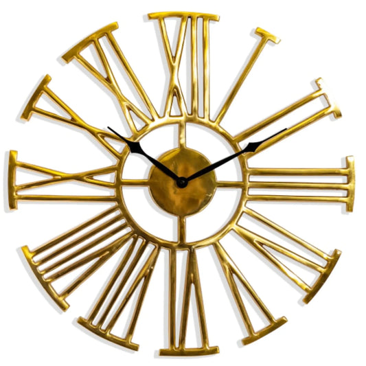 Gold wall clock with Roman numeral design on a white background