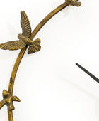 Decorative wall clock with bird designs on a white background