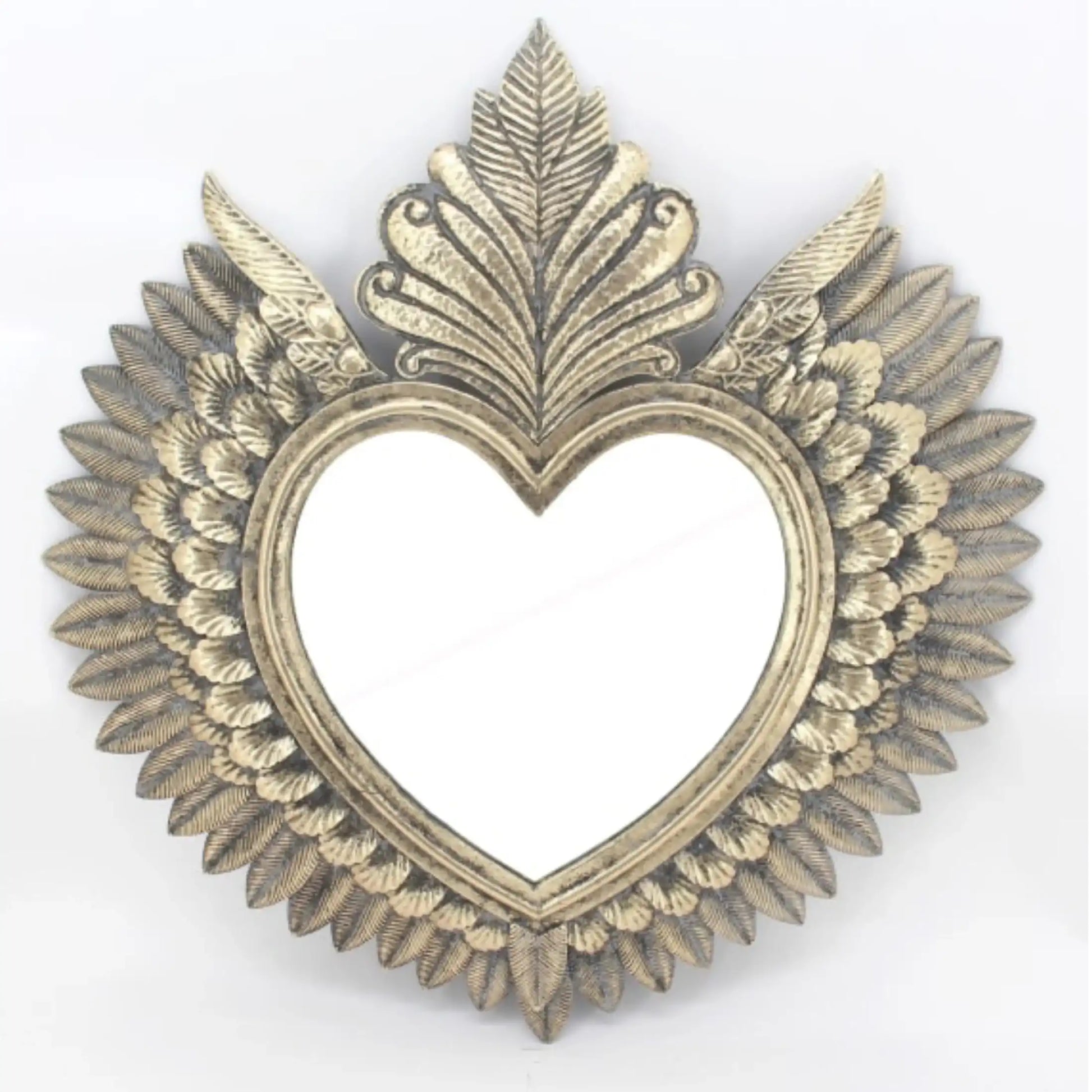 Decorative heart-shaped frame with leaf-like designs on a white background