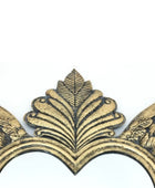 Decorative gold leaf design on a white background