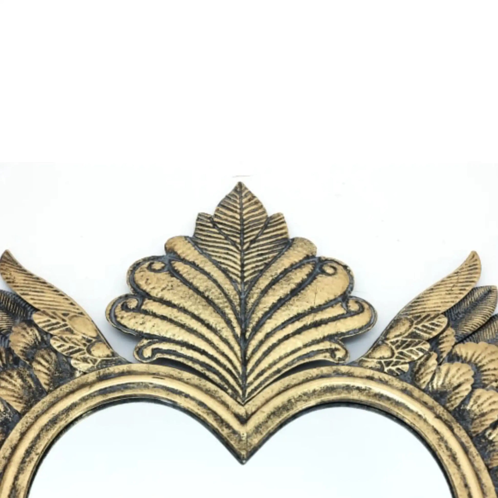 Decorative gold leaf design on a white background