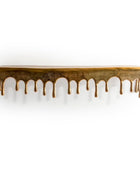 Wooden shelf with a decorative edge on a white background