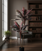 Potted plant in a room with a bookshelf and window