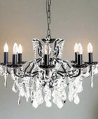 Black chandelier with crystal accents on a white background