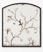 Arched framed wall art featuring a delicate bird and blossom illustration on a warm off-white background, enclosed in a thin black frame.