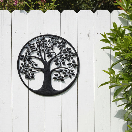 Black metal tree of life wall art on a white background