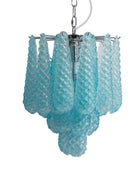 Turquoise glass chandelier with a white background