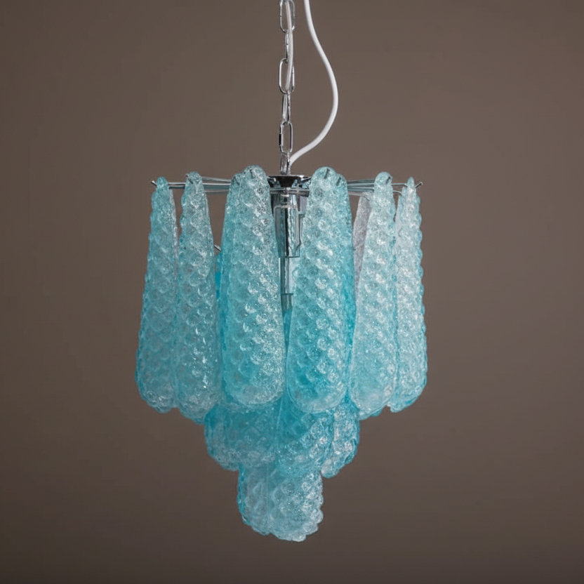 Turquoise glass chandelier against a brown background