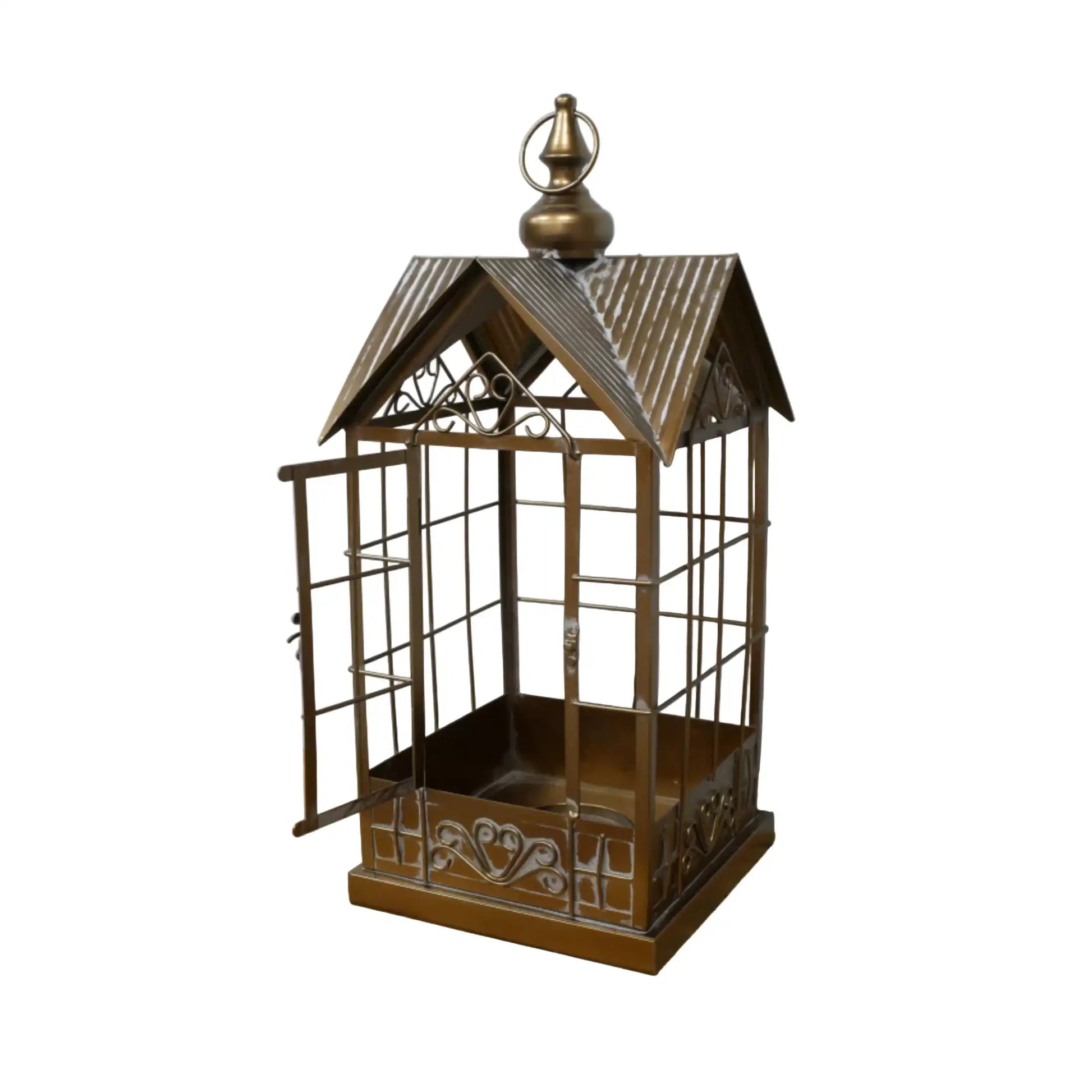 Decorative metal birdcage with a roof on a wooden surface