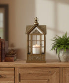 Decorative lantern with a candle inside on a wooden surface.