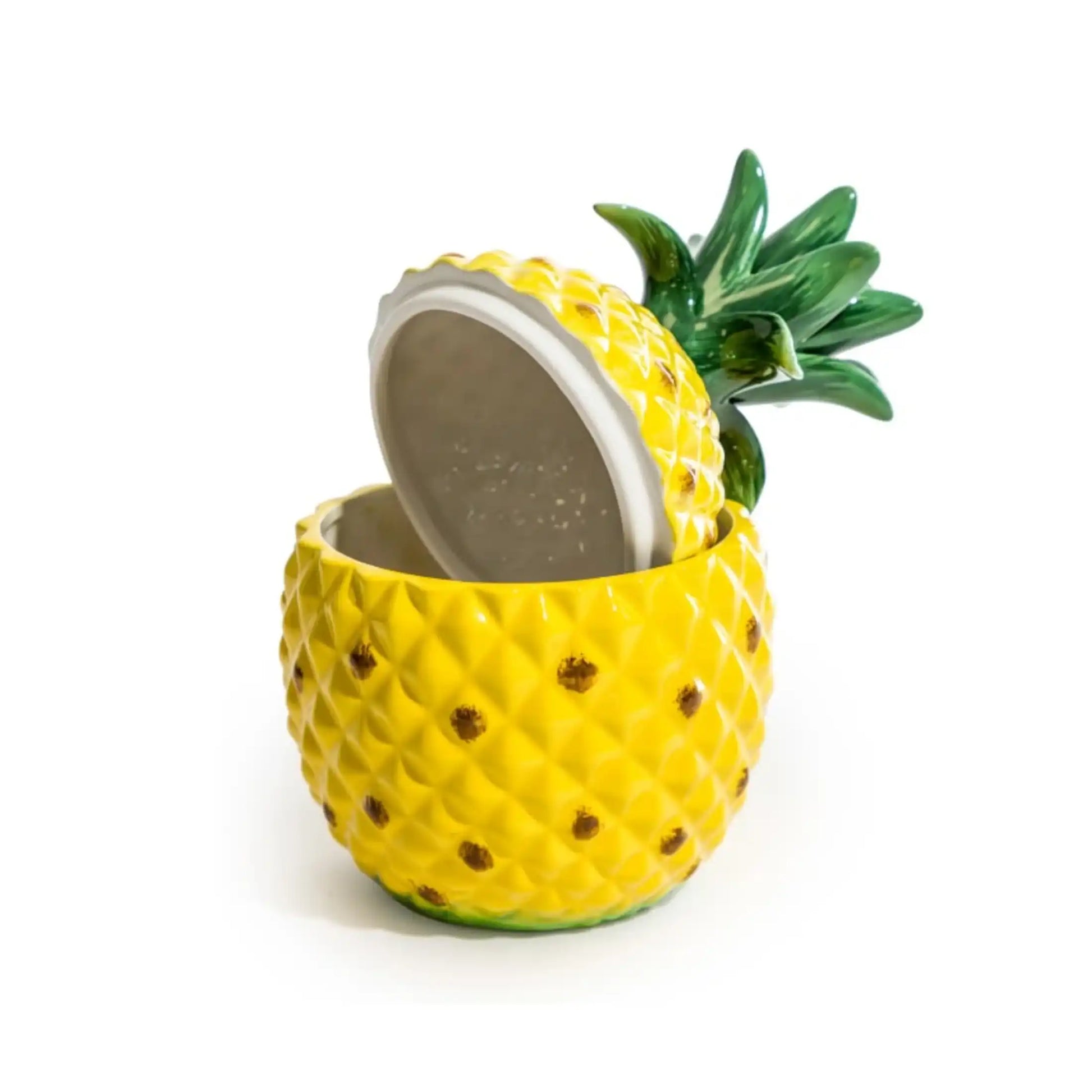 Pineapple-shaped container with a lid on a white background