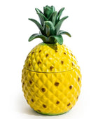 Pineapple-shaped container with a lid on a white background
