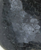 Close-up of a cracked surface with a textured pattern