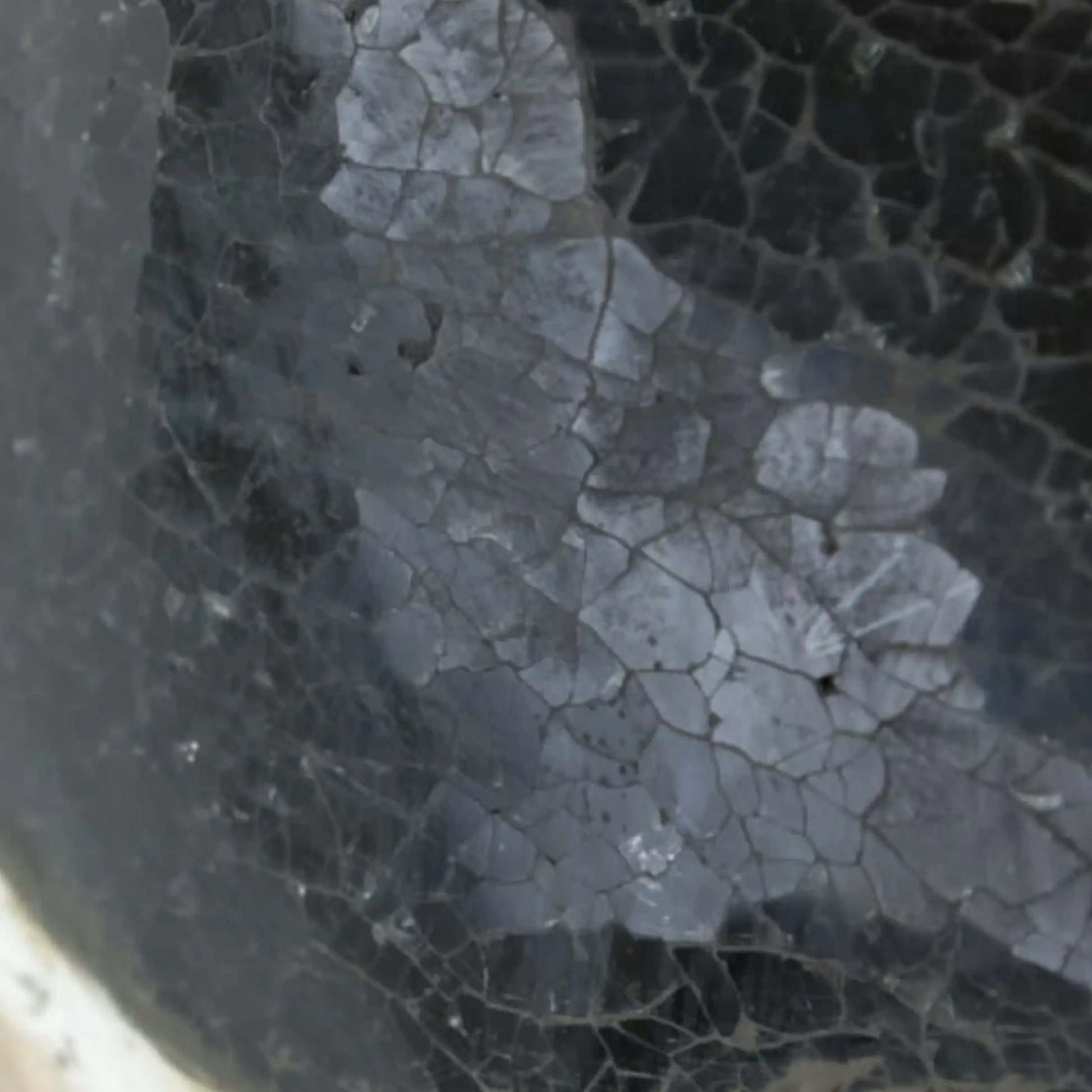 Close-up of a cracked surface with a textured pattern