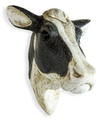 Decorative cow head sculpture on a white background