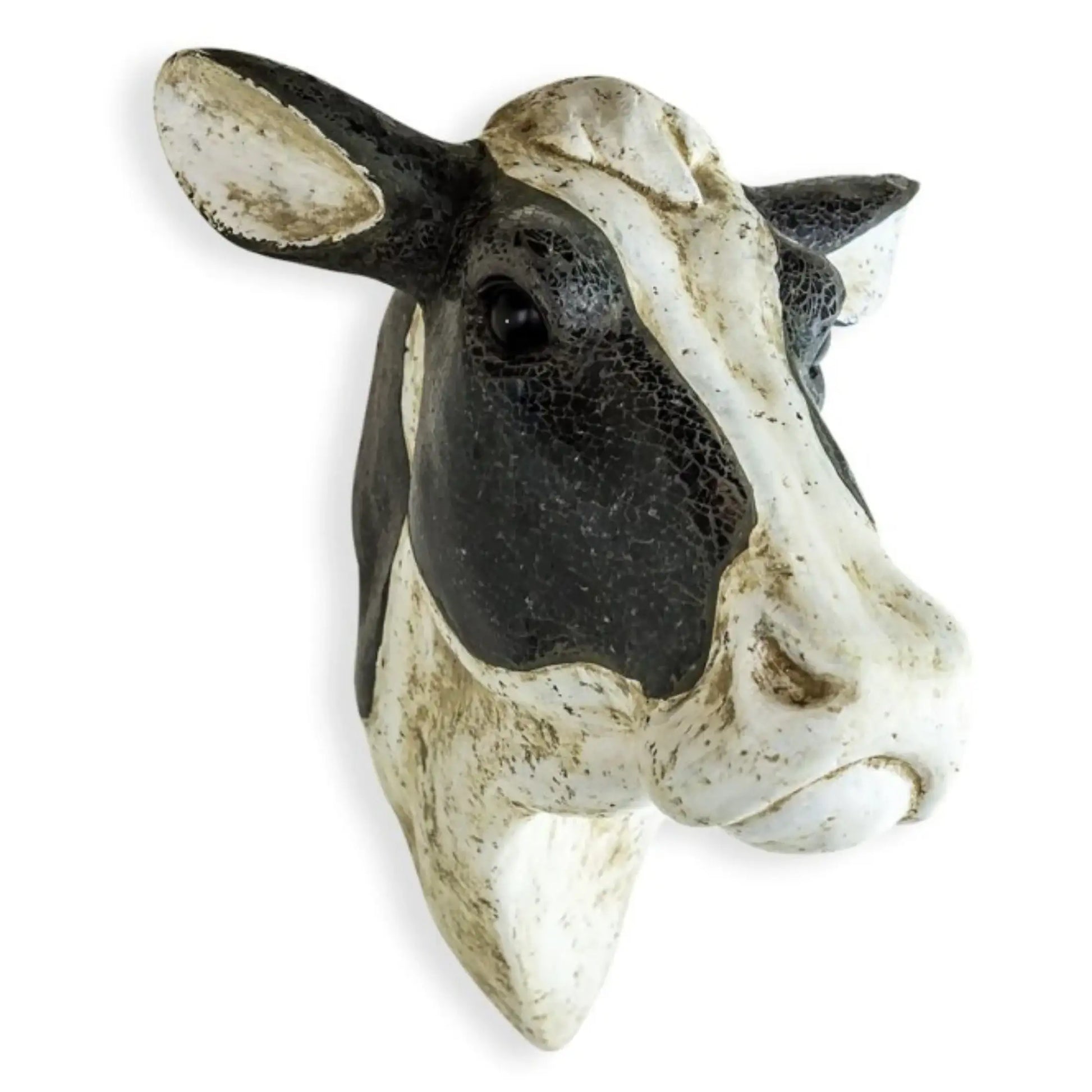 Decorative cow head sculpture on a white background