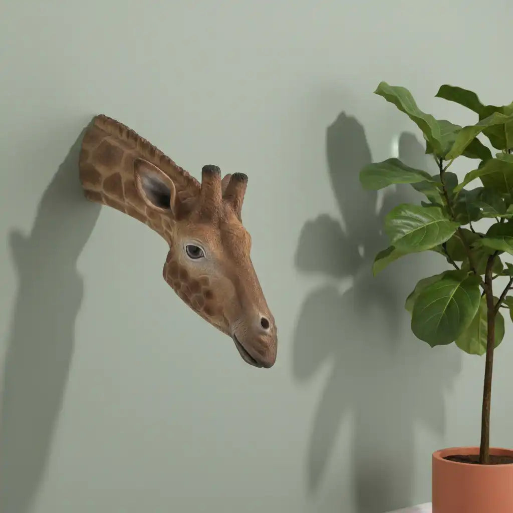 Giraffe head sculpture on a plain background