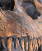 Close-up of a rusted metal gear with teeth on a blurred background