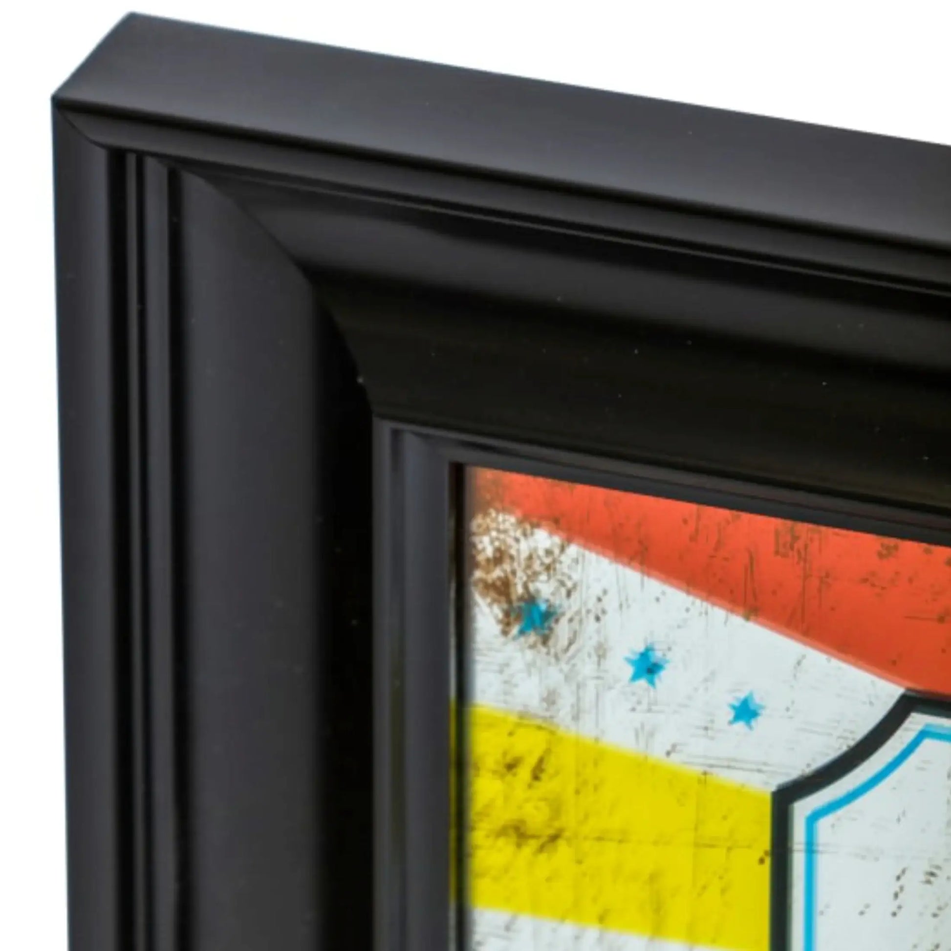 Close-up of a black framed artwork with a colorful abstract design.