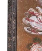 Close-up of a classical painting with hands clasped, showing signs of aging.