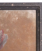 Close-up of a textured surface with a decorative element, possibly from a painting or artwork.