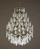 Decorative chandelier with white crystal elements on a brown background
