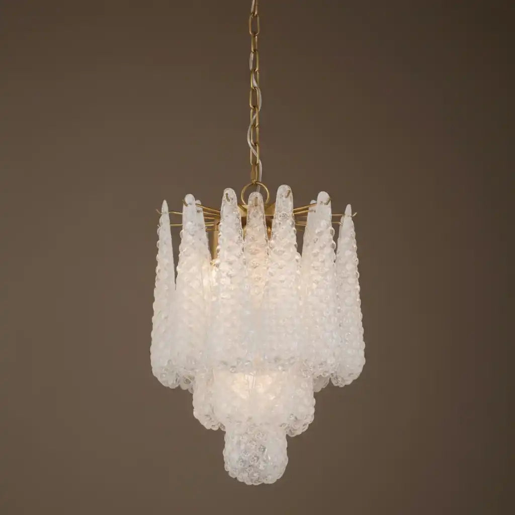 Chandelier with white glass shades on a brown background