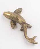 Bronze fish sculpture on a white background