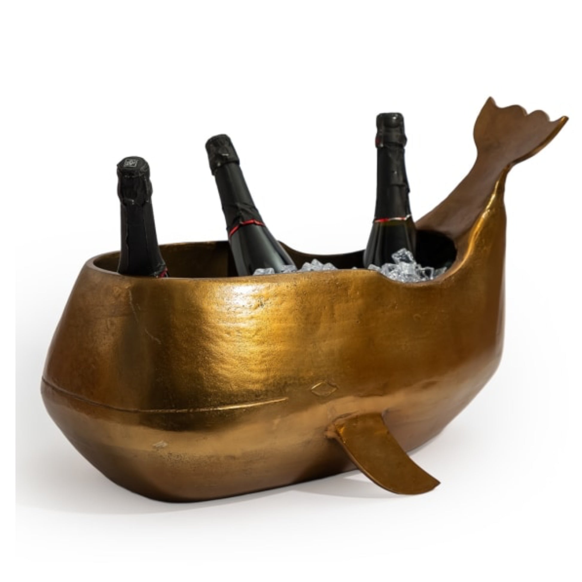 Gold whale-shaped wine cooler with bottles inside on a white background