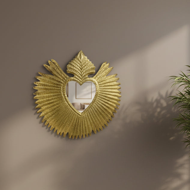 Decorative gold mirror with fan-like design on a beige wall