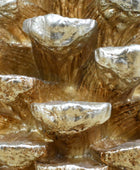 Close-up of a textured gold and silver decorative object