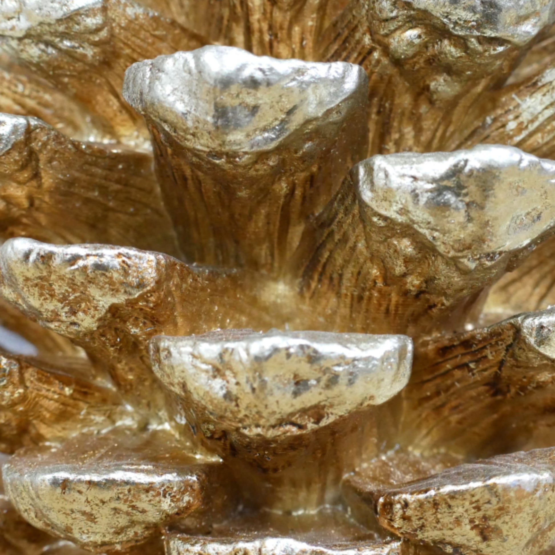 Close-up of a textured gold and silver decorative object