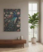 Peacock tapestry on a wall above a wooden console table with a plant in the corner.