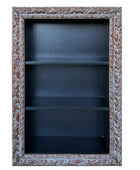 Decorative bookshelf with ornate frame on a white background