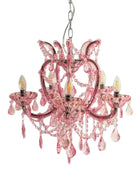 Pink chandelier with crystal accents on a white background